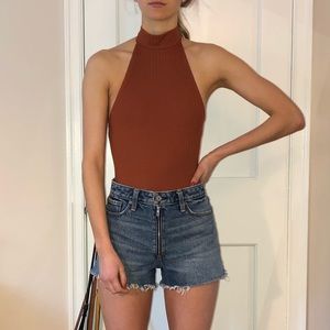 Rust orange ribbed backless bodysuit.